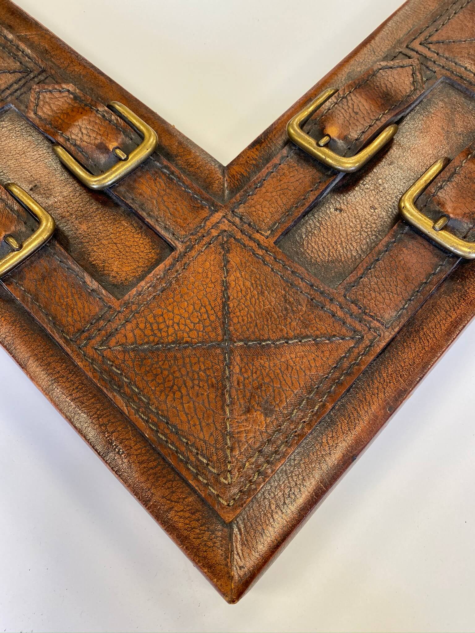custom framing chicaog, custom framing nashville, brown leather frame with buckles