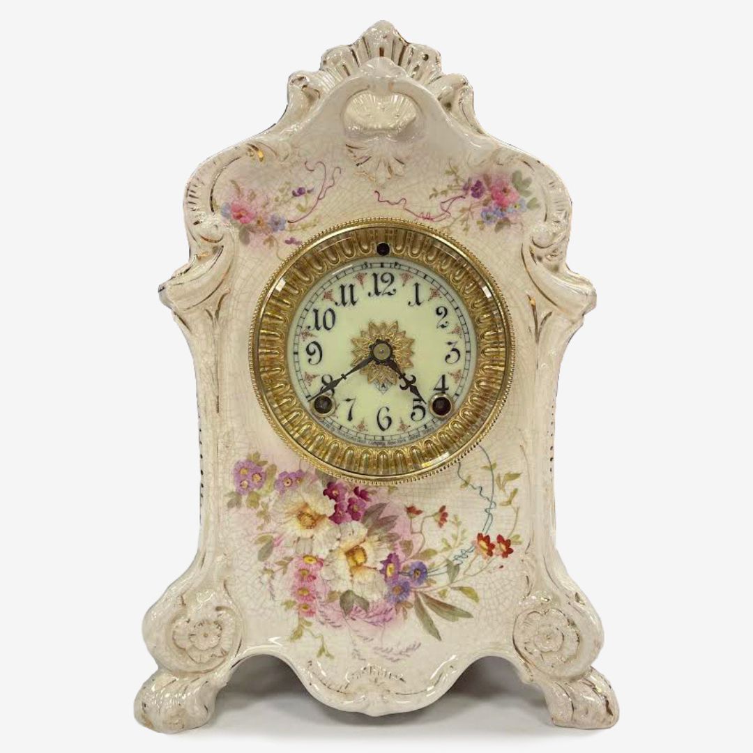 An antique Ansoina mantel clock after is was fully restored.